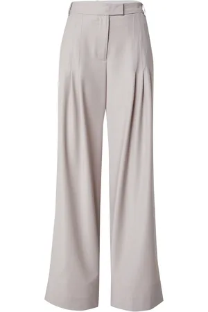REMAIN Pantalón plisado