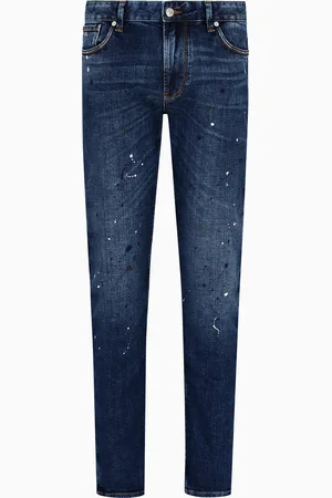 Emporio Armani Vaqueros J06 slim fit de denim con manchas de pintura