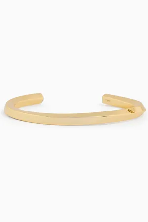 Emporio Armani Pulsera tipo brazalete de latón en tono dorado