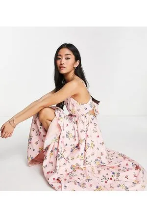 Collective The Label Vestido midi rosa escalonado con estampado de florecitas y lazo en la espalda de
