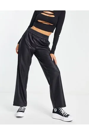 ONLY Pantalones negros de pernera recta con cinturilla elástica de cuero sintético de