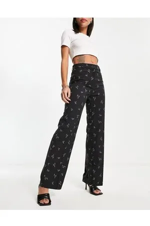 Monki Pantalones negros de corte sartorial con estampado floral de (parte de un conjunto)