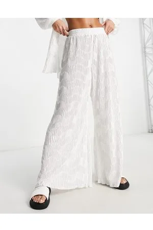 South Beach Pantalones blancos de pernera ancha plisados de