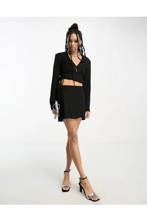Annorlunda Minifalda negra con diseño envolvente de (parte de un conjunto)