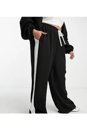 ASOS Pantalones negros sin cierres con panel en contraste de ASOS DESIGN Curve-Marrón