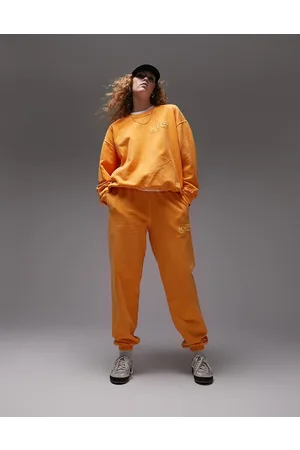 Topshop Joggers naranjas extragrandes con lavado vintage y estampado en relieve NYC Project de (parte de un conjunto)