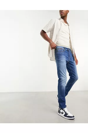 Tommy Hilfiger Vaqueros azules con lavado medio de corte tapered slim Austin de