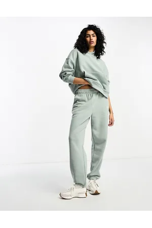 New Balance Joggers verde salvia con cremallera Linear Heritage de