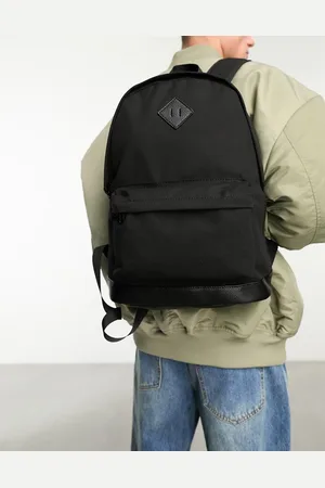 ASOS Mochila negra de lona con base de cuero sintético de