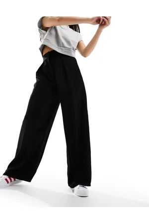 River Island Pantalones negros plisados de pernera ancha de