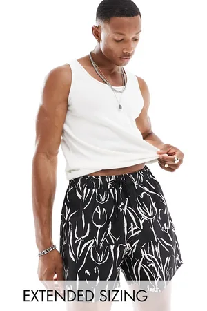 ASOS Shorts de baño cortos blancos y negros con estampado floral de