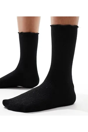 VERO MODA Calcetines negros con acabado de purpurina y volante en el borde de canalé de