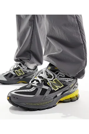New Balance Zapatillas de deporte oscuro y amarillas 1906 de