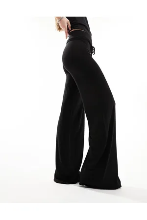 COLLUSION Pantalones de yoga negros de talle bajo de