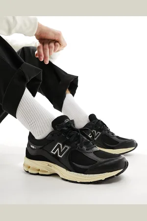 New Balance Zapatillas de deporte negras de cuero 2002 de