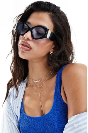 Jeepers Peepers Gafas de sol azules y doradas estilo ojos de gato de