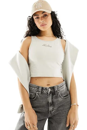 New Era Camiseta blanco hueso sin mangas con logo de texto de