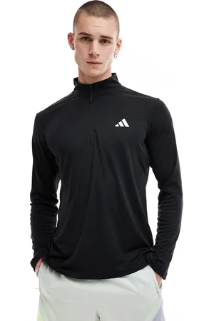 adidas Camiseta negra con media cremallera de adidas Training Essentials