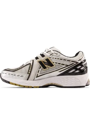 New Balance Zapatillas de deporte plateadas y doradas 1906 de
