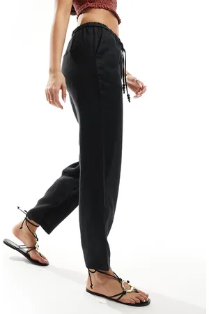 MANGO Pantalones negros con lazada en la cintura de lino de