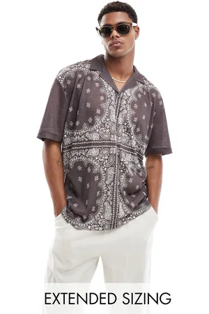ASOS Polo extragrande con estampado de cachemir y cuello de solapas de