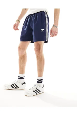 adidas Shorts de baño azules marino con trébol y 3 rayas de