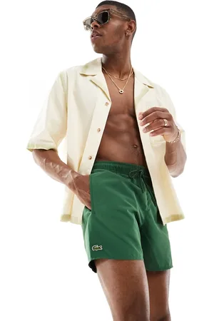 Lacoste Shorts de baño oscuro con logo de