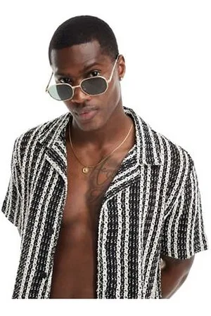 River Island Gafas de sol doradas con montura hexagonal estrecha de metal Coined de