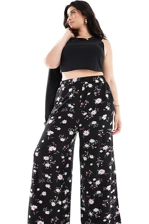Yours Pantalones de pernera ancha con estampado de margaritas de