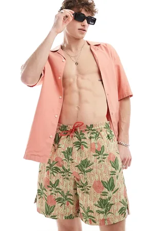 Hunky Trunks Shorts de baño verdes con estampado de palmeras de tejido texturizado de