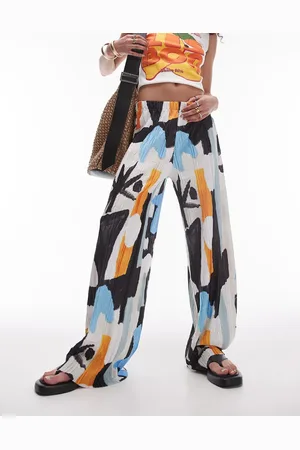 Topshop Pantalones plisados con estampado artístico abstracto de tejido rugoso de