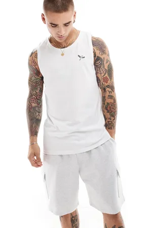 Threadbare Camiseta blanca sin mangas con pájaro bordado de