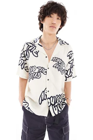 Dr Denim Camisa color holgada de manga corta con estampado gráfico azul marino Madi exclusiva en ASOS de -Blanco