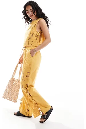 ASOS Pantalones amarillos con diseño calado y detalle de lazadas premium de