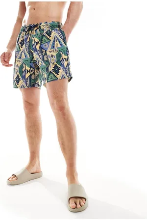 ASOS Shorts de baño azules de largo medio con estampado abstracto de