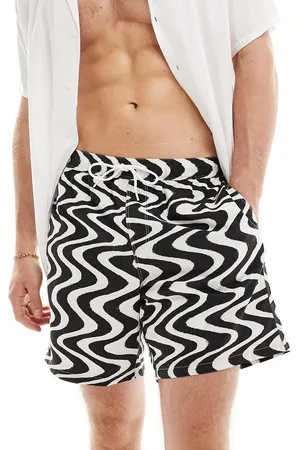 ASOS Shorts de baño de largo medio negros con estampado ondulado de