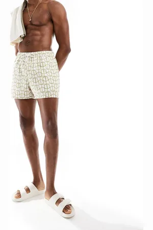 ASOS Shorts de baño cortos rosas con estampado geométrico de