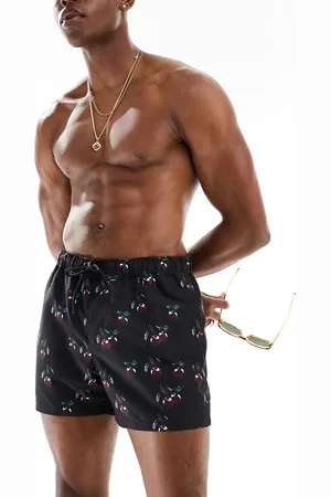 ASOS Shorts de baño cortos negros con estampado de cereza de