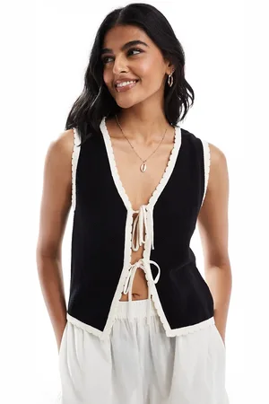 ASOS Chaleco negro con ribetes color crema en contraste de punto de
