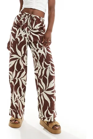 New Look Pantalones de pernera ancha con estampado de palmas de