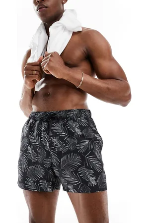 ASOS Shorts de baño cortos negros con estampado de hojas de palmera de