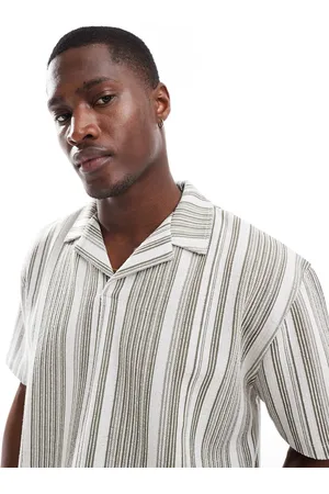 ASOS Polo a rayas holgado con cuello de solapas de