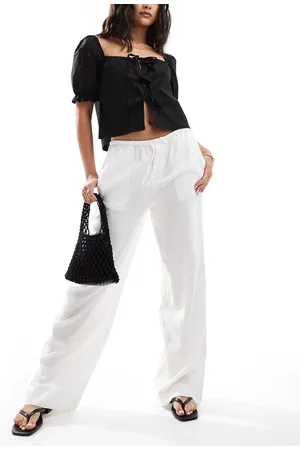MANGO Pantalones blancos holgados de pernera recta de mezcla de lino de