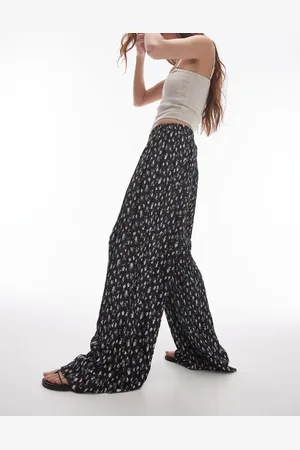 Topshop Pantalones monocromáticos plisados de pernera ancha con estampado de florecitas de tejido efecto rugoso de -Multicolor