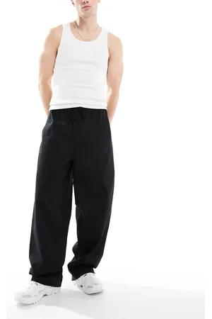 COLLUSION Pantalones negros de corte skater holgados de