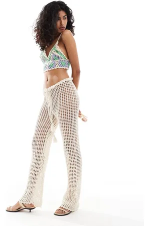 MANGO Pantalones playeros blancos con lazada en la cintura de croché de