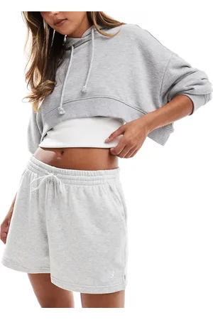 New Balance Pantalones cortos grises de felpa de rizo Sport Essentials de