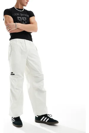 A Bathing Ape Pantalones blanco hueso de estilo carpintero de