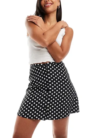 Miss Selfridge Minifalda negra con vuelo, estampado de lunares y botones de -Negro