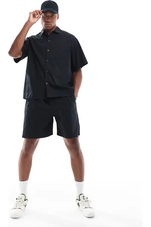 SELECTED Pantalones cortos negros de (parte de un conjunto)